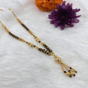 Short Mangalsutra with a delicate gold-plated chain adorned with classic black beads
